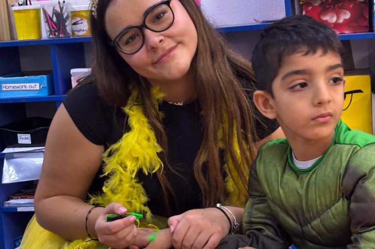 “IB DP Year 1 students from LWIS-AiS celebrating Halloween with KG1–KG3 children through crafts, games, and storytelling – fostering creativity, empathy, and service.”