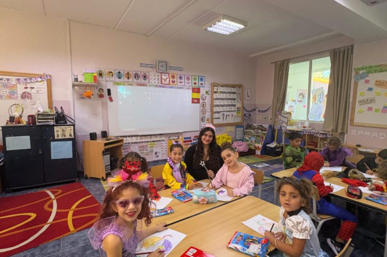 “IB DP Year 1 students from LWIS-AiS celebrating Halloween with KG1–KG3 children through crafts, games, and storytelling – fostering creativity, empathy, and service.”