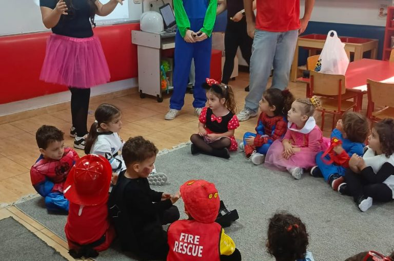 “IB DP Year 1 students from LWIS-AiS celebrating Halloween with KG1–KG3 children through crafts, games, and storytelling – fostering creativity, empathy, and service.”
