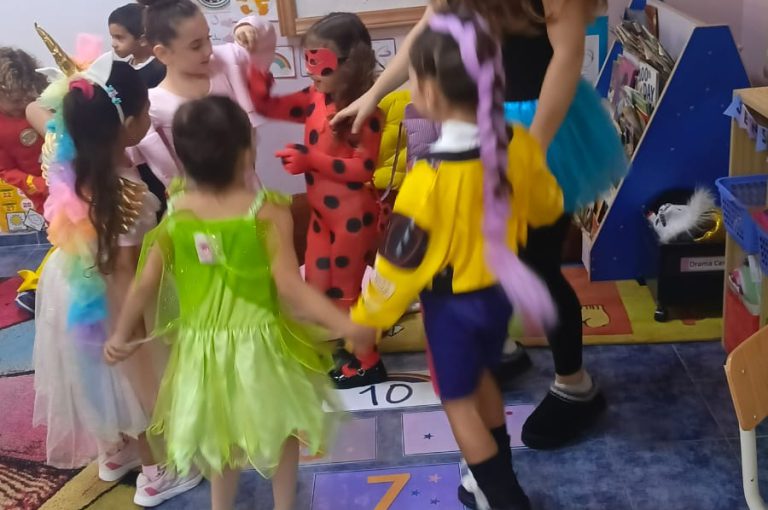 “IB DP Year 1 students from LWIS-AiS celebrating Halloween with KG1–KG3 children through crafts, games, and storytelling – fostering creativity, empathy, and service.”