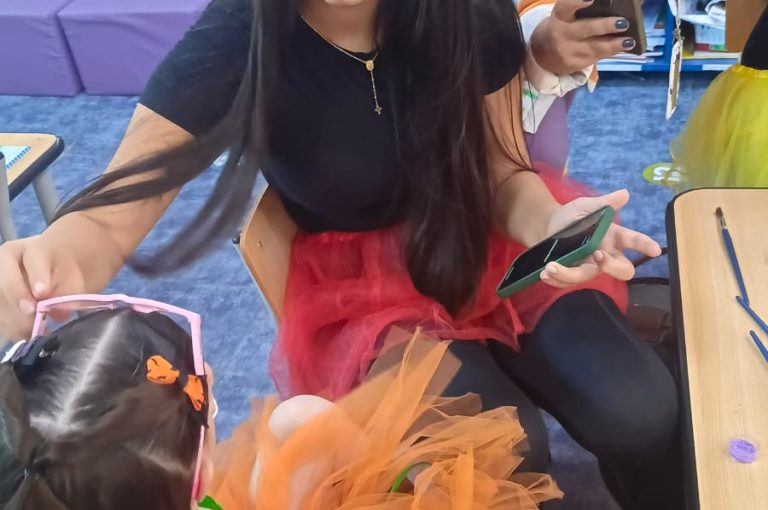 “IB DP Year 1 students from LWIS-AiS celebrating Halloween with KG1–KG3 children through crafts, games, and storytelling – fostering creativity, empathy, and service.”