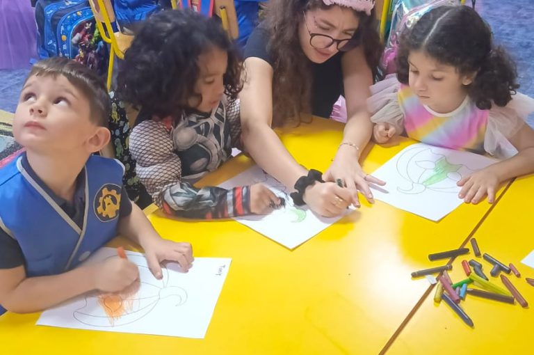 “IB DP Year 1 students from LWIS-AiS celebrating Halloween with KG1–KG3 children through crafts, games, and storytelling – fostering creativity, empathy, and service.”