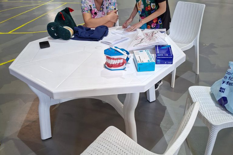 KG1 to Grade 1 students getting their teeth checked and learning basic dental care.