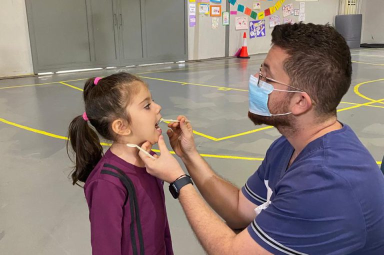 KG1 to Grade 1 students getting their teeth checked and learning basic dental care.