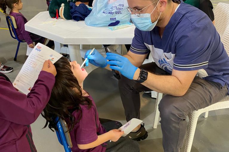 KG1 to Grade 1 students getting their teeth checked and learning basic dental care.