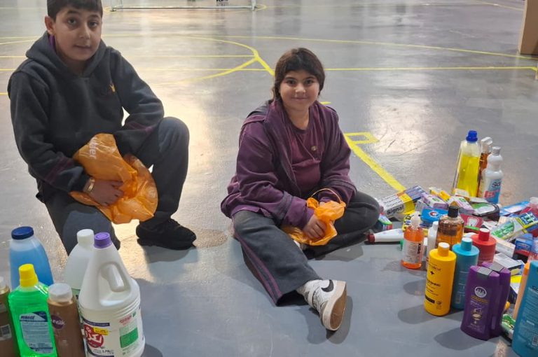 Students from Grades 2 to 5 at LWIS-AiS packing materials for the school’s Service-Learning program