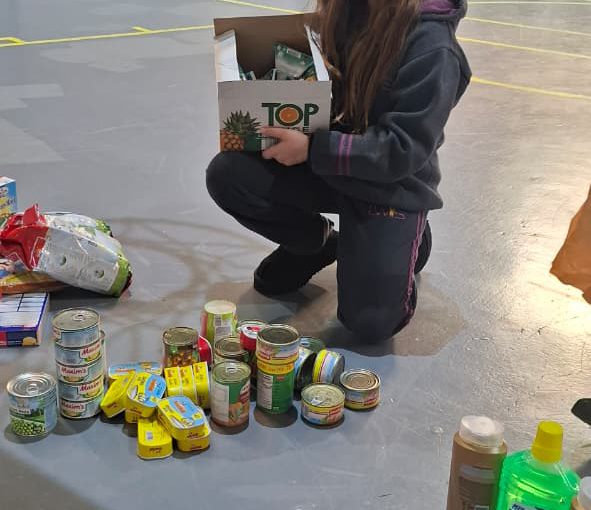 Students from Grades 2 to 5 at LWIS-AiS packing materials for the school’s Service-Learning program
