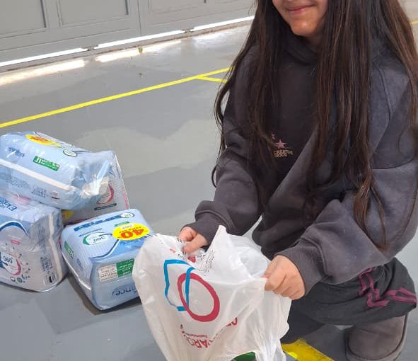 Students from Grades 2 to 5 at LWIS-AiS packing materials for the school’s Service-Learning program