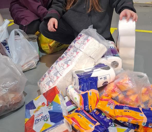 Students from Grades 2 to 5 at LWIS-AiS packing materials for the school’s Service-Learning program