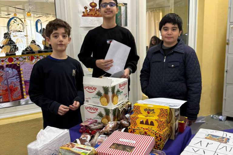 Students from the Middle and Senior School attending the HLSS Fair at the Upper Campus during the Arabic Night theme, with traditional decorations, cultural outfits, and festive activities.