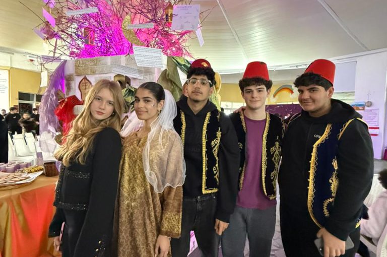 Students from the Middle and Senior School attending the HLSS Fair at the Upper Campus during the Arabic Night theme, with traditional decorations, cultural outfits, and festive activities.