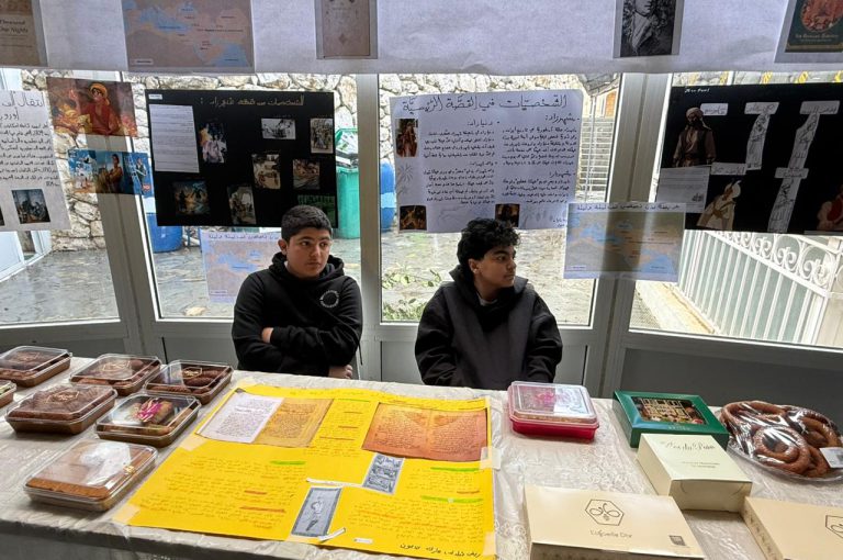Students from the Middle and Senior School attending the HLSS Fair at the Upper Campus during the Arabic Night theme, with traditional decorations, cultural outfits, and festive activities.