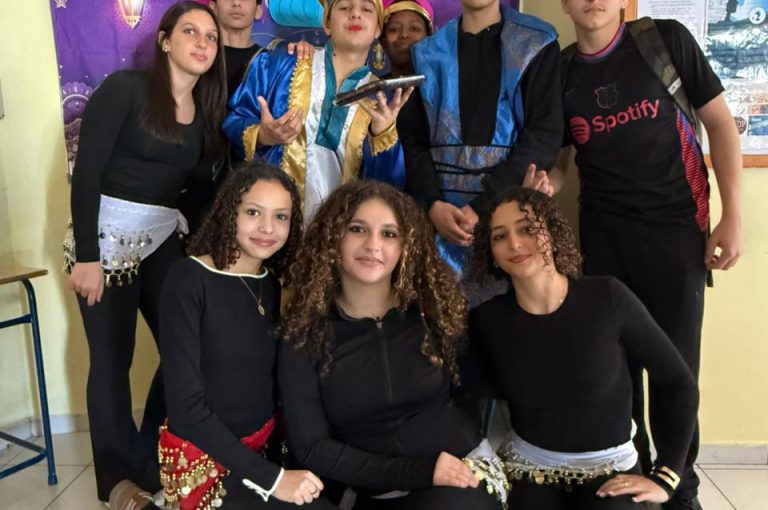 Students from the Middle and Senior School attending the HLSS Fair at the Upper Campus during the Arabic Night theme, with traditional decorations, cultural outfits, and festive activities.