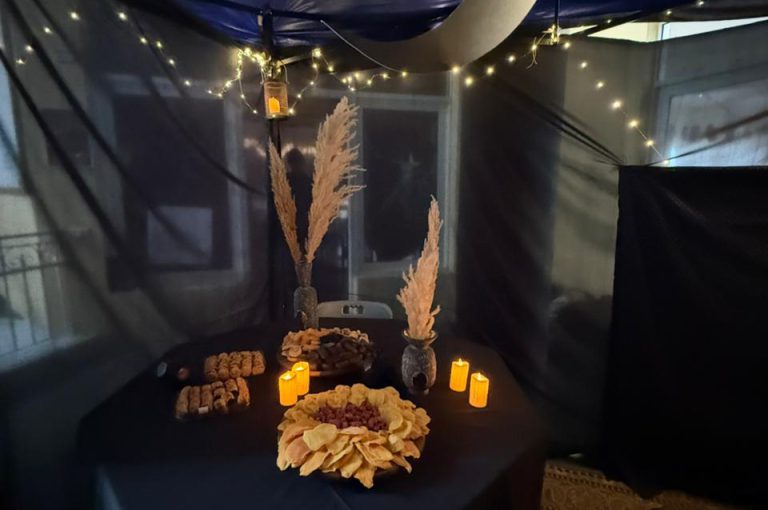 Students from the Middle and Senior School attending the HLSS Fair at the Upper Campus during the Arabic Night theme, with traditional decorations, cultural outfits, and festive activities.