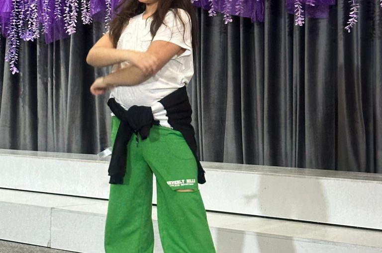Lower School students performing various acts on stage during a talent show.