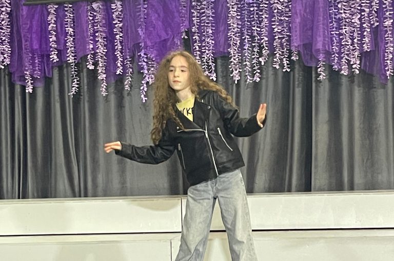Lower School students performing various acts on stage during a talent show.
