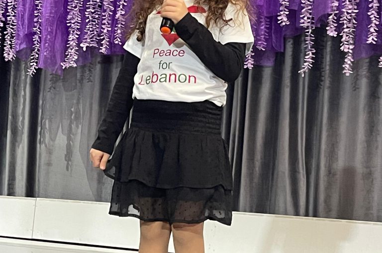 Lower School students performing various acts on stage during a talent show.