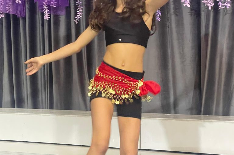 Lower School students performing various acts on stage during a talent show.