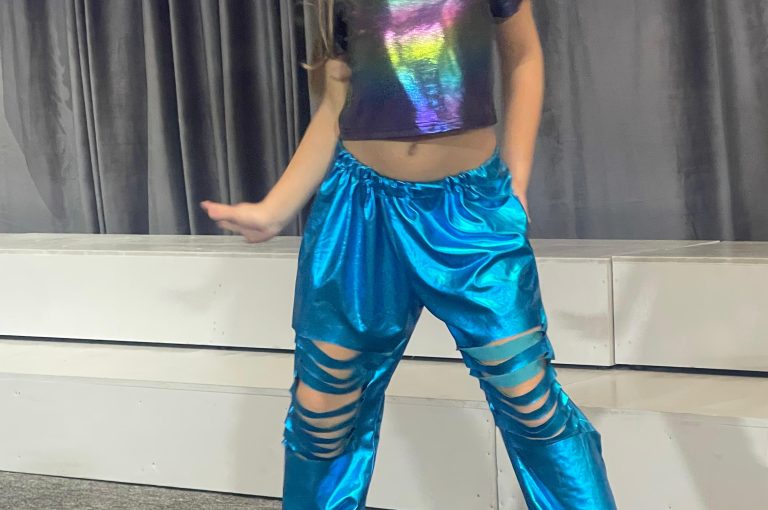 Lower School students performing various acts on stage during a talent show.