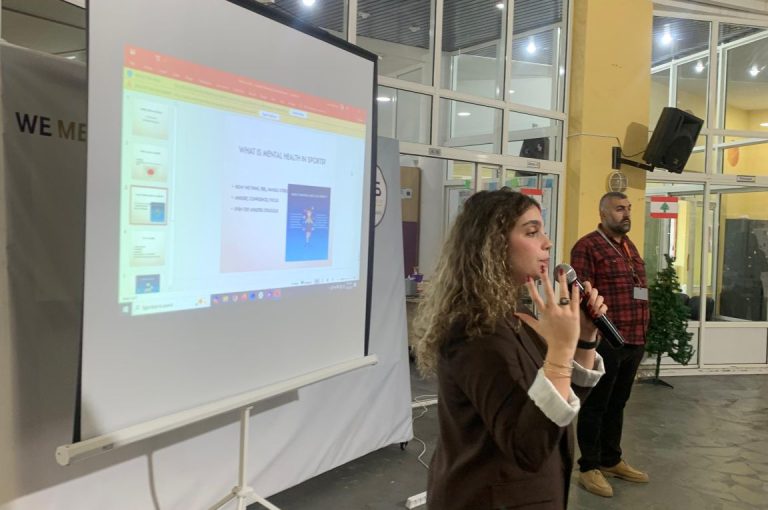 Representative from Step Ahead Sports School speaking to LWIS Adma International School students about mental health in sports, with interactive team-building activities promoting resilience and communication