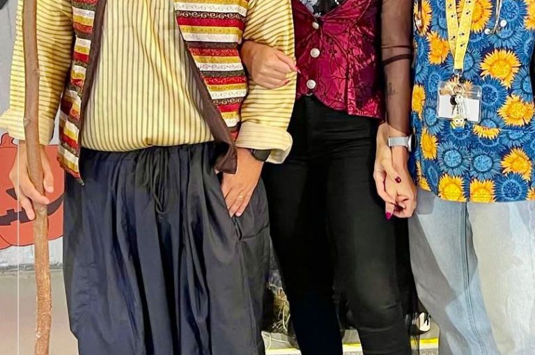 Teachers in costumes celebrating and interacting during Barbara Day at the lower campus