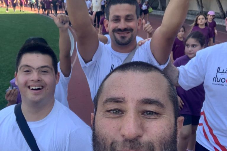 LWIS AIS students running in a cross-country race alongside participants from Al Younbouh.