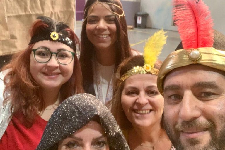 Teachers in costumes celebrating and interacting during Barbara Day at the lower campus