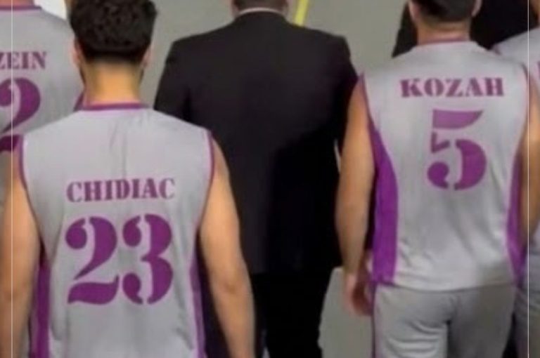 Team huddle showing unity, determination, and school spirit before winning the Round of 16 basketball match and qualifying for the Quarter Finals of the Lebanese School Basketball Championship.