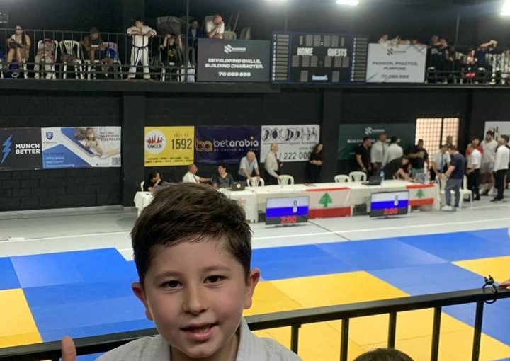 Young judo athlete Vicken Margossian proudly celebrating his second-place achievement in the Lebanese Schools Judo Competition.