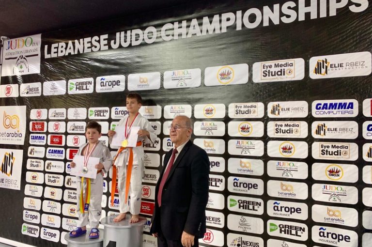 Young judo athlete Vicken Margossian proudly celebrating his second-place achievement in the Lebanese Schools Judo Competition.