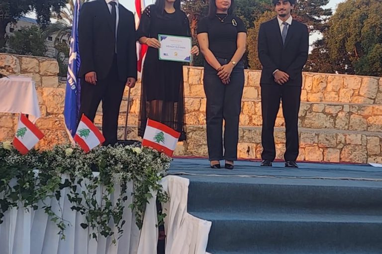 Jeya Geagea, Wendy Sleiman, and Chafic Chbat representing their school at the Future Debate Masters competition, achieving Top 4 in their first participation with a strong debate on population control, showcasing confidence, teamwork, and public speaking excellence.