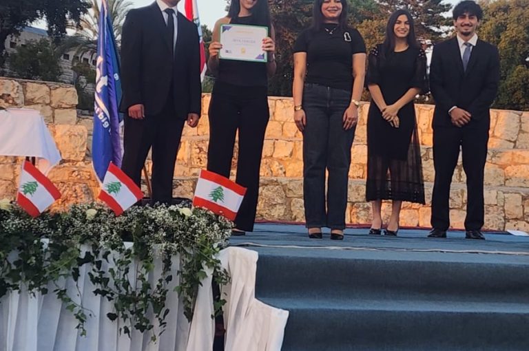 Jeya Geagea, Wendy Sleiman, and Chafic Chbat representing their school at the Future Debate Masters competition, achieving Top 4 in their first participation with a strong debate on population control, showcasing confidence, teamwork, and public speaking excellence.