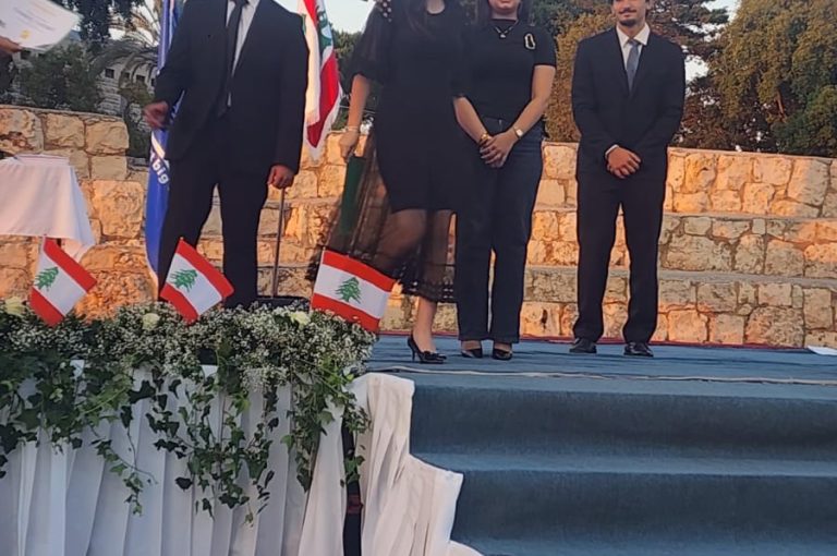 Jeya Geagea, Wendy Sleiman, and Chafic Chbat representing their school at the Future Debate Masters competition, achieving Top 4 in their first participation with a strong debate on population control, showcasing confidence, teamwork, and public speaking excellence.