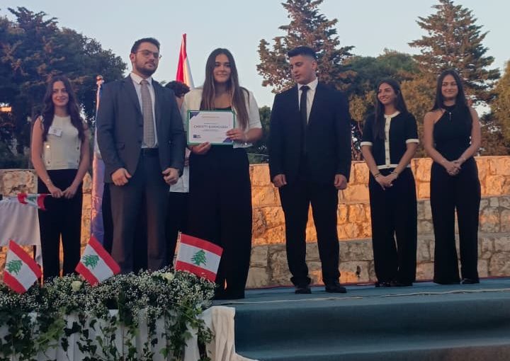 Jeya Geagea, Wendy Sleiman, and Chafic Chbat representing their school at the Future Debate Masters competition, achieving Top 4 in their first participation with a strong debate on population control, showcasing confidence, teamwork, and public speaking excellence.