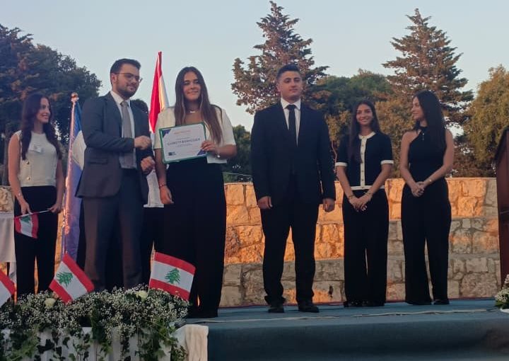 Jeya Geagea, Wendy Sleiman, and Chafic Chbat representing their school at the Future Debate Masters competition, achieving Top 4 in their first participation with a strong debate on population control, showcasing confidence, teamwork, and public speaking excellence.